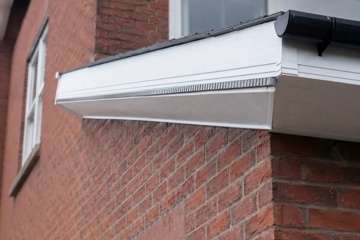 Close view of a renewed fascia and soffit at the eaves