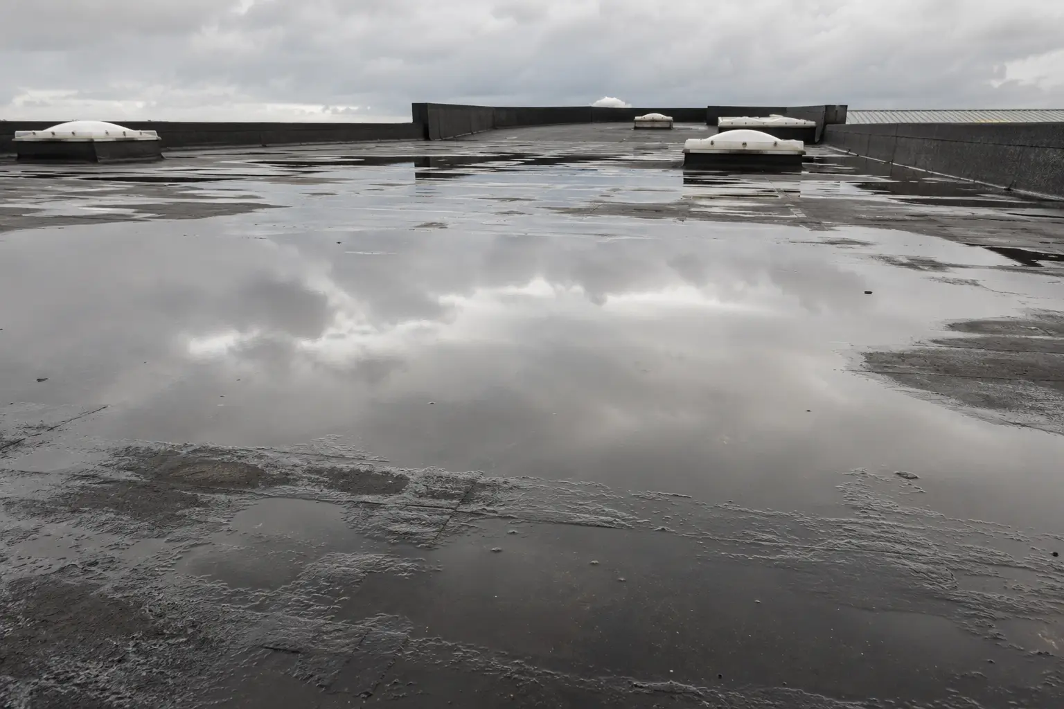Ponding water on an aged flat roof