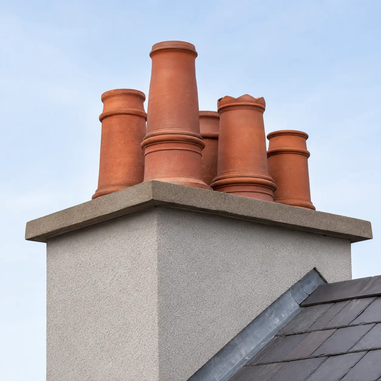 Clay chimney pots and lead soakers on a Dublin roof