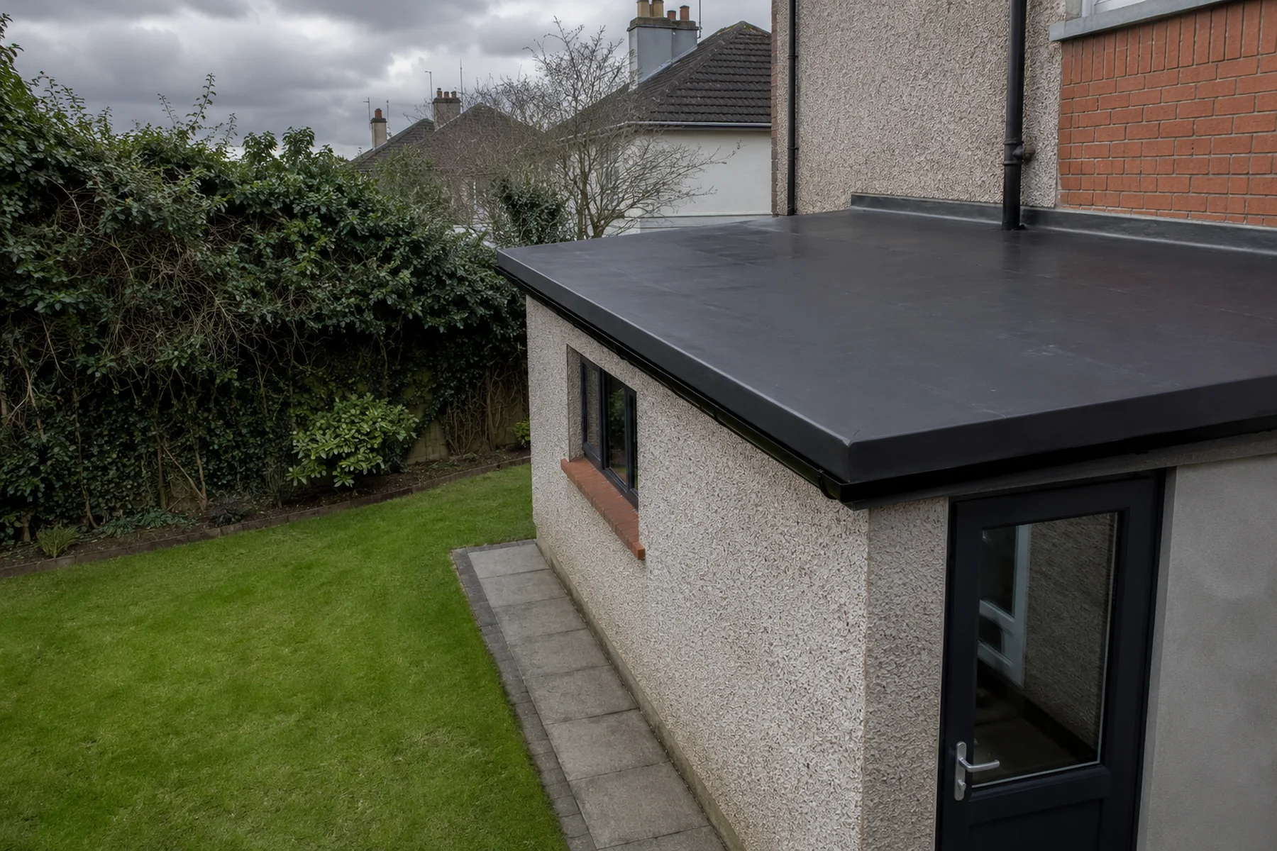 A tired felt flat roof on a Dublin extension before re-covering