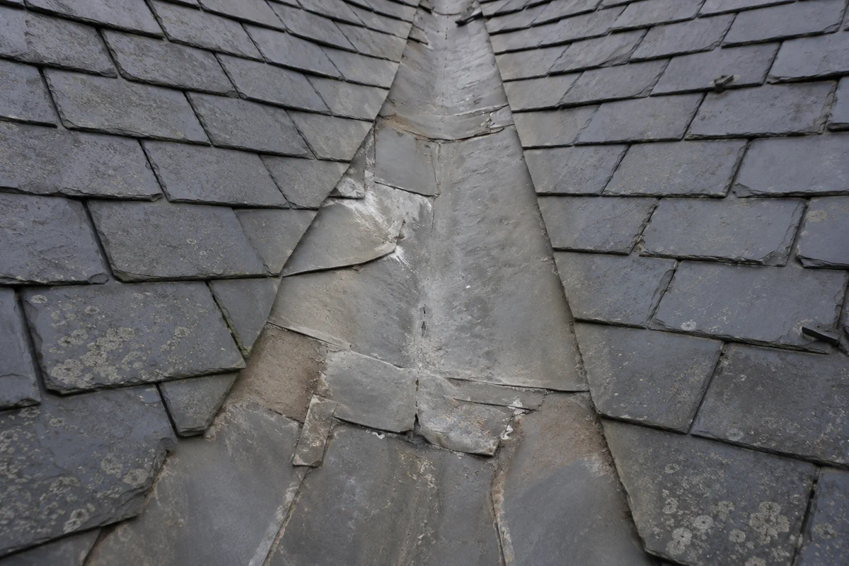 An old cracked lead valley on a Dublin period roof before re-lining