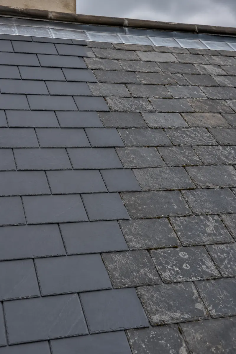 New and weathered natural slate matched side by side on a Dublin period roof
