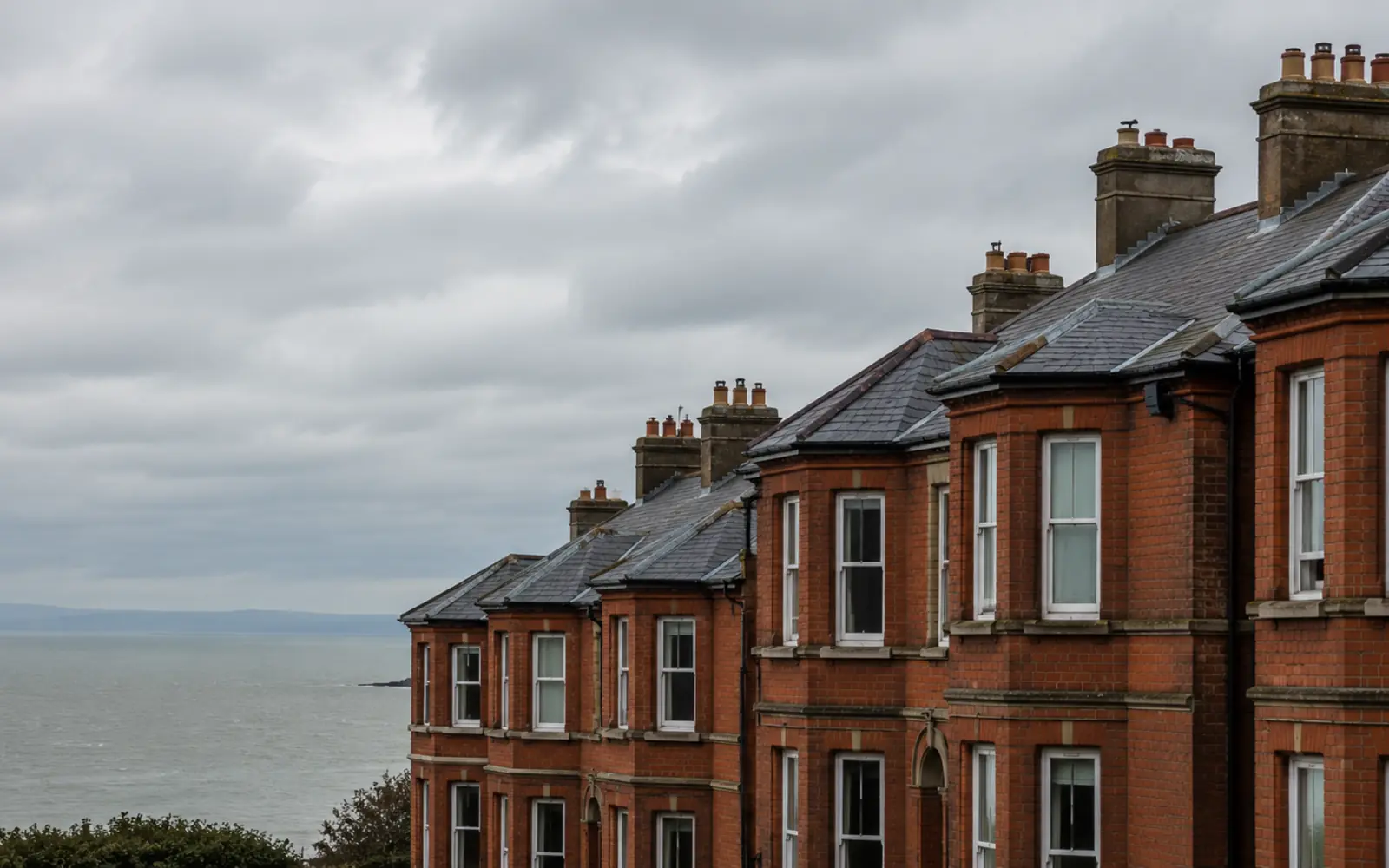 Edwardian red-brick homes with slate roofs and brick chimney stacks in Clontarf, Dublin