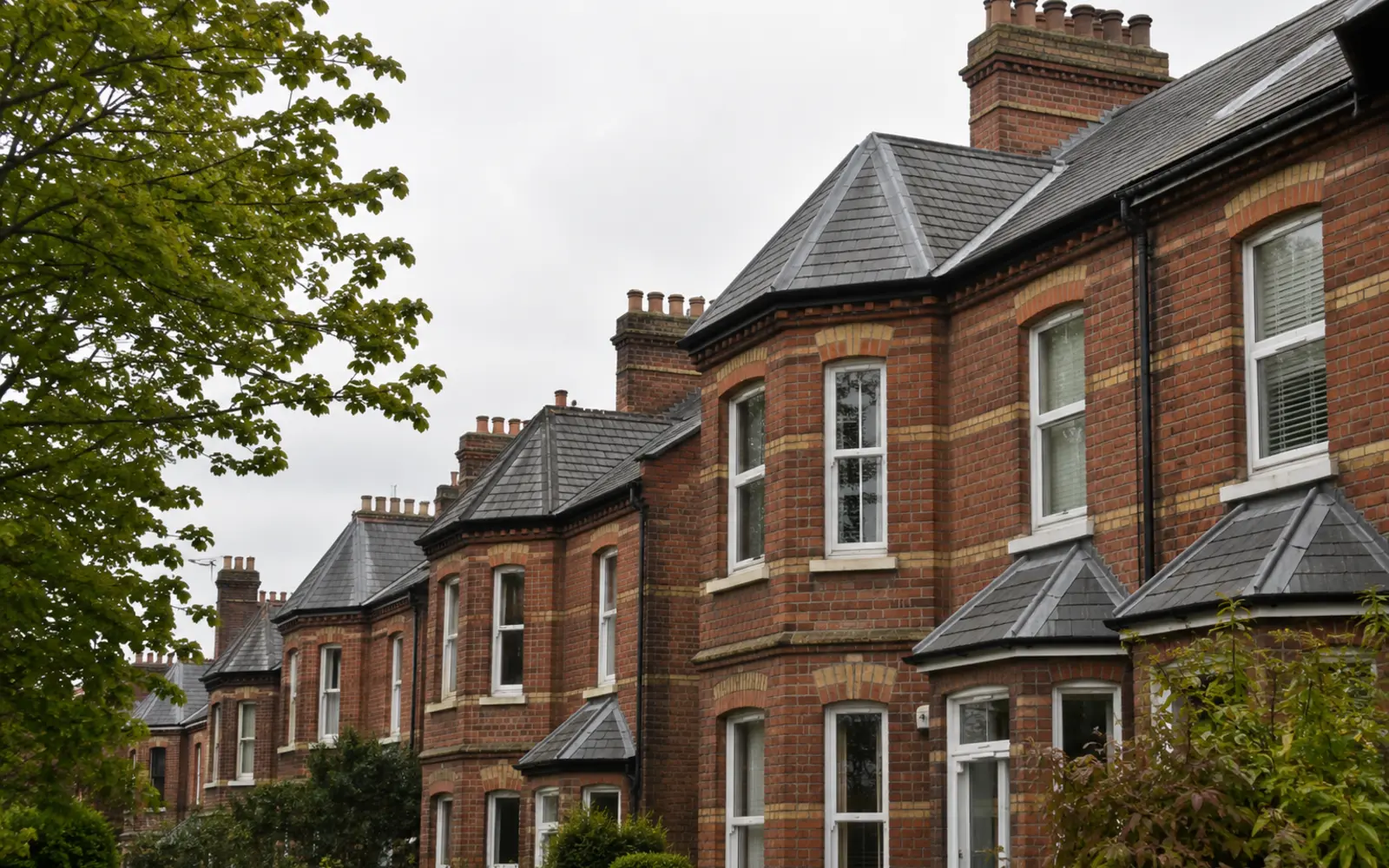 A hipped Victorian slate villa roof with tall chimney stacks in Rathgar, Dublin
