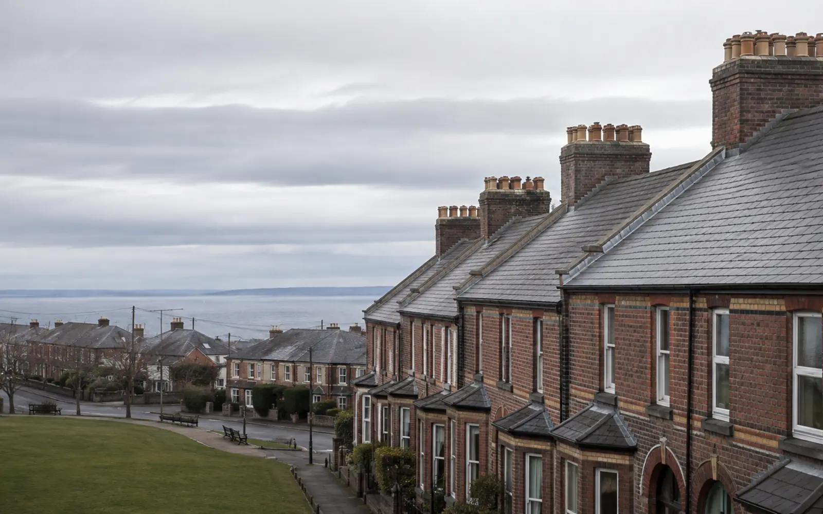 Victorian red-brick terrace roofs and chimney stacks near the seafront in Sandymount, Dublin