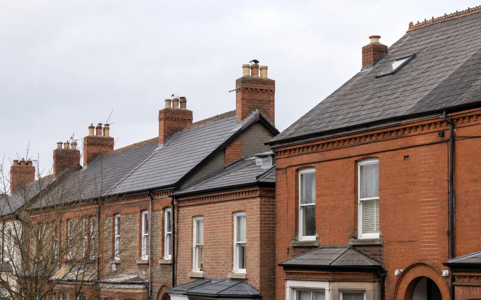 Edwardian red-brick semis with slate roofs and chimney stacks in Terenure, Dublin