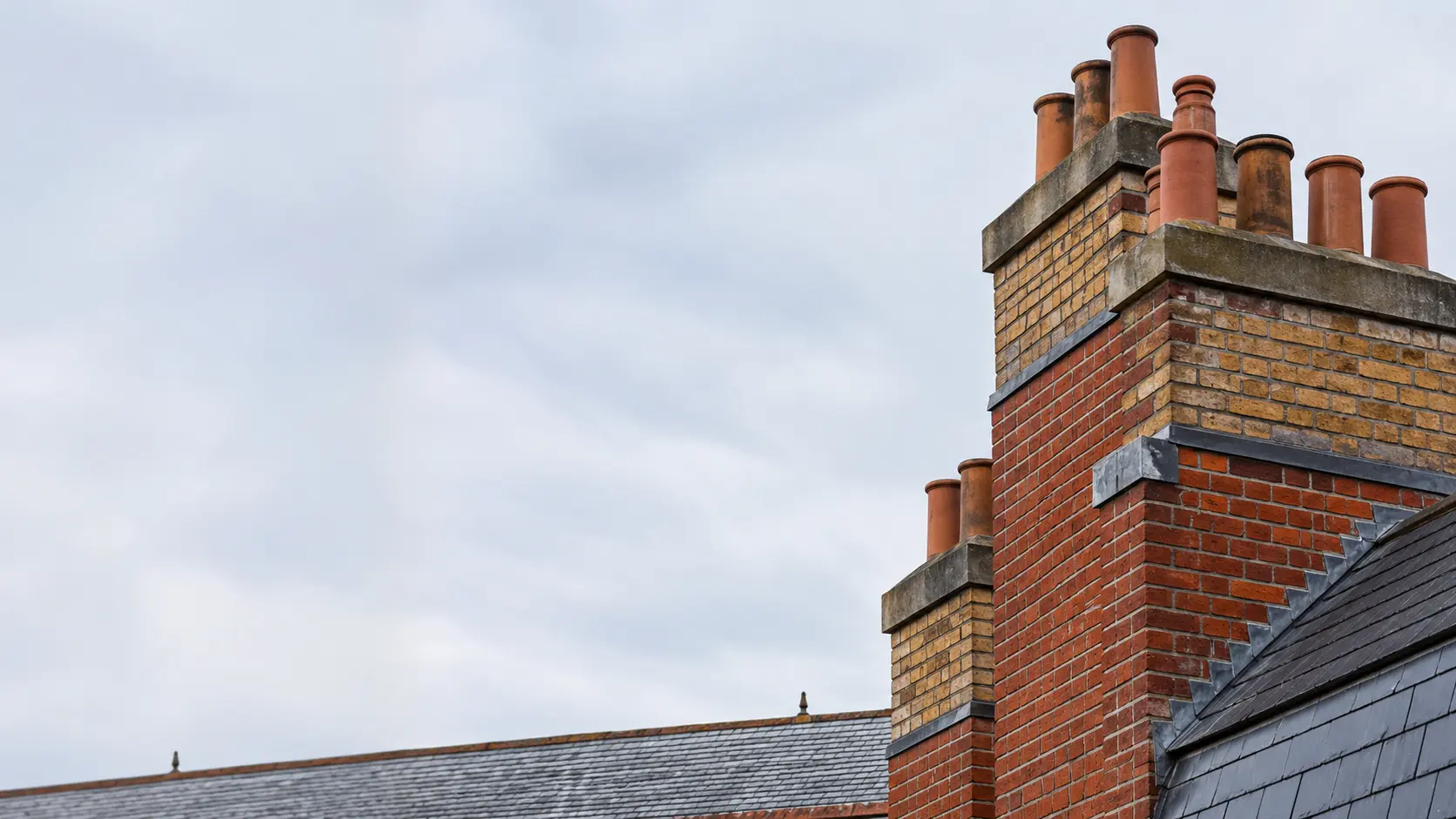 Brick chimney stacks on a Dublin roofline