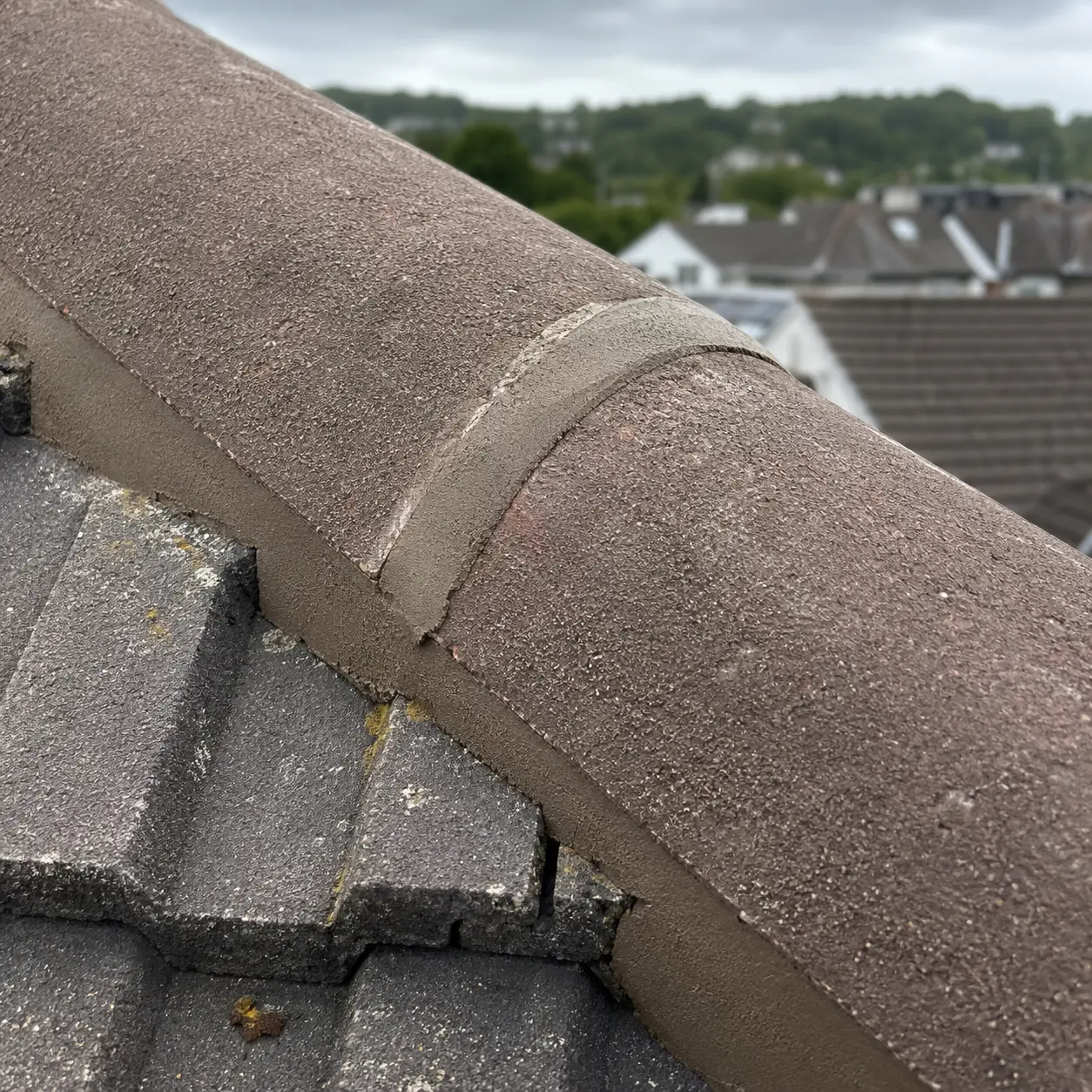 A Dublin roofer working near a rooflight