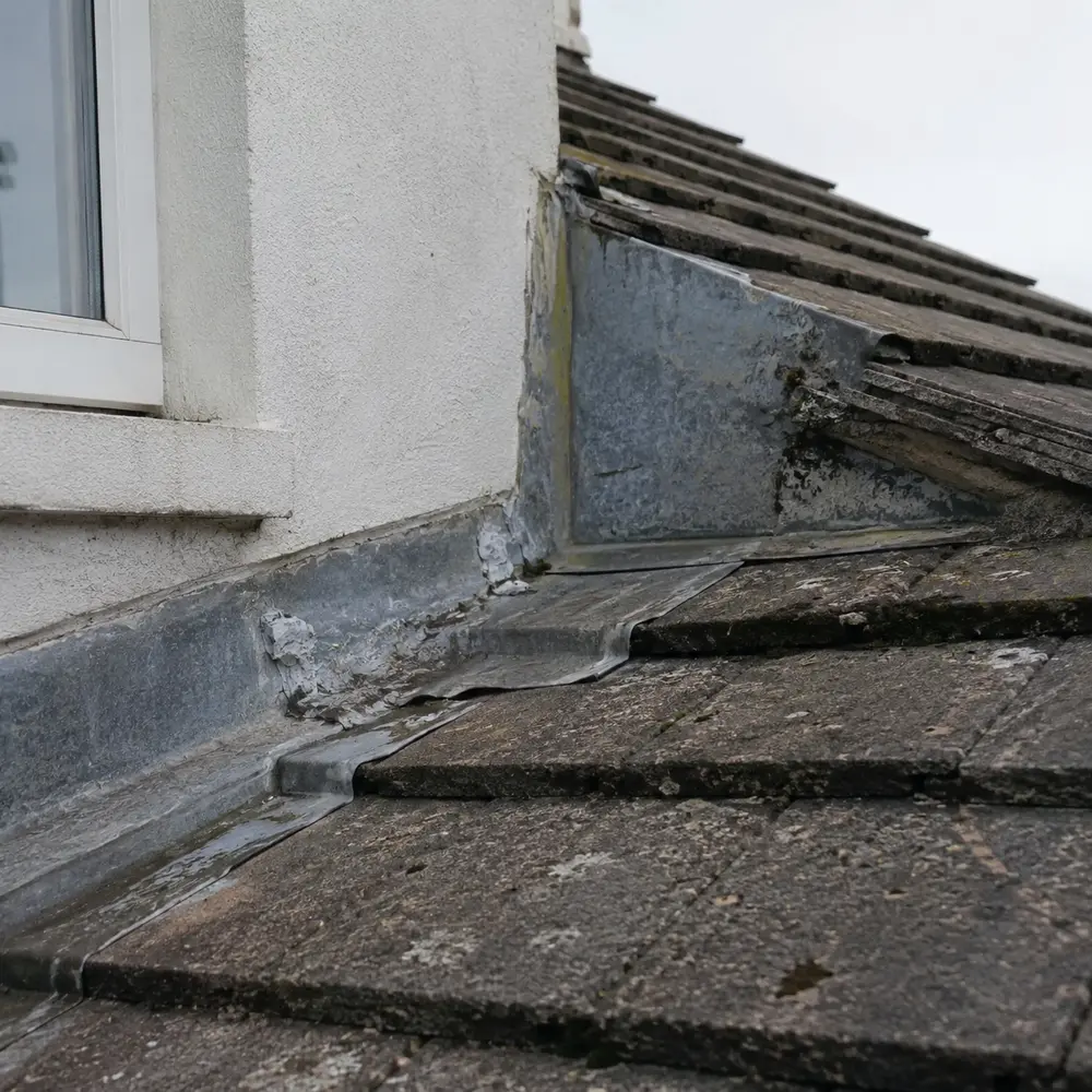 Old flashing where a dormer meets the main roof on a Dublin house