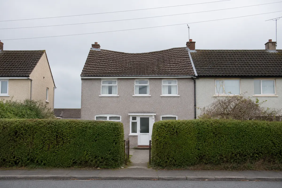 A dip in a suburban Dublin roofline seen from the road