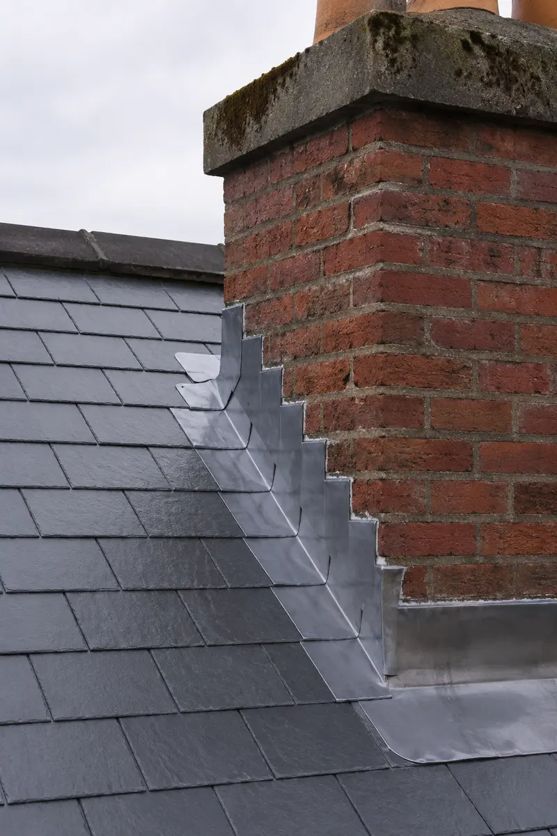 New lead flashing dressed around a brick chimney stack on a Dublin Georgian roof