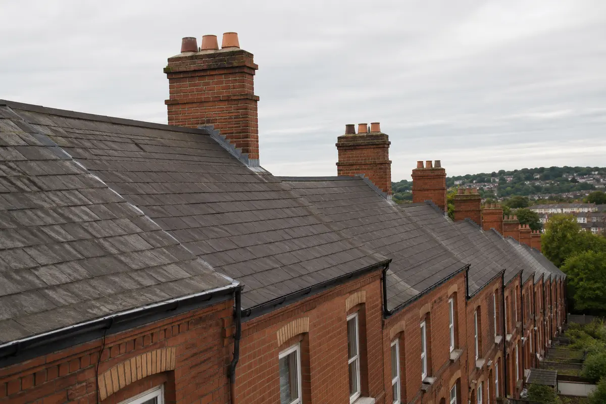 A run of Victorian red-brick roofs in Dublin showing their age