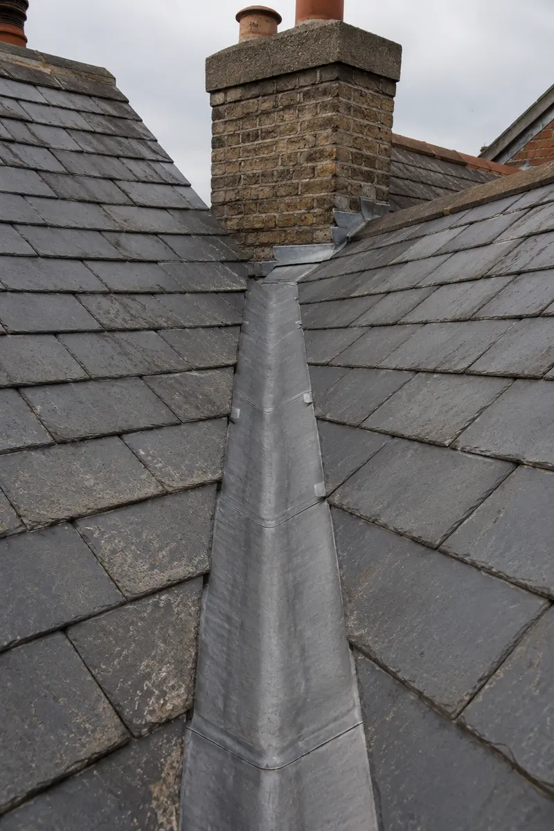 A lead valley gutter running between two Victorian terrace roofs in Dublin