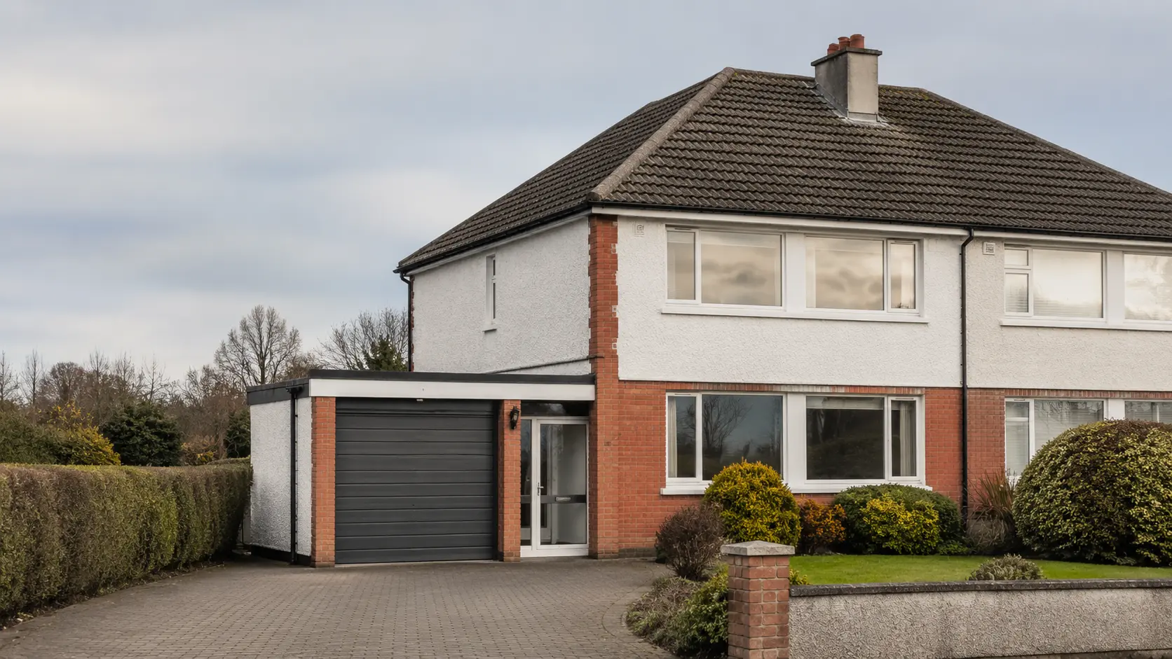 A 1960s three-bed semi with a hipped tiled roof in Dublin
